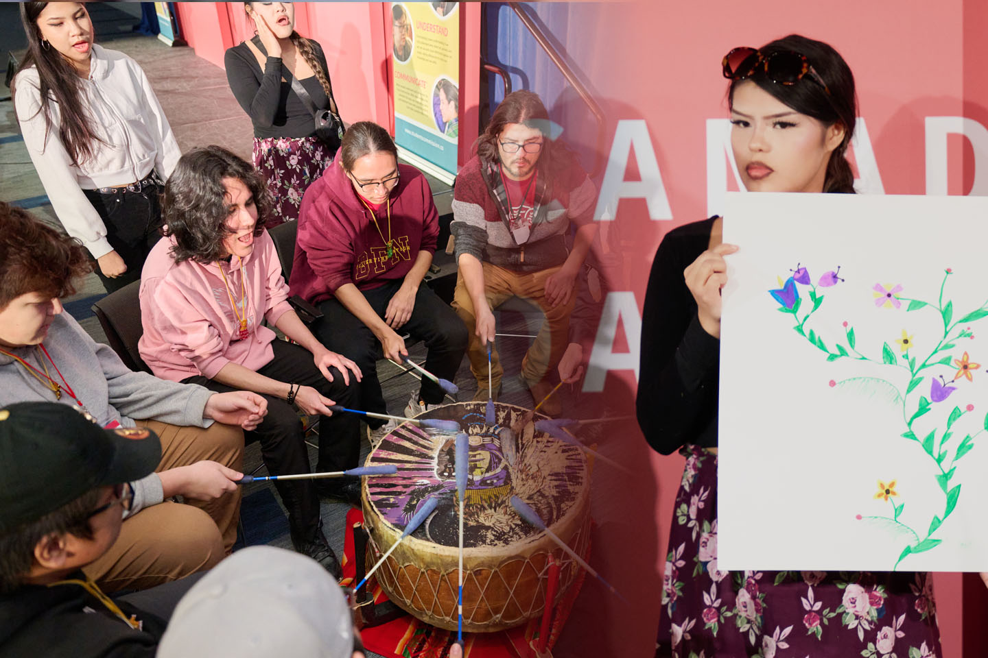 Indigenous drummers circle and young person presenting team ideas.